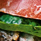 digital edit of a bacon hamburger with lettuce about to be eaten