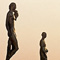 the eiffel tower in paris in front of a building with statues