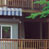 digital edit of a two story house on the lake