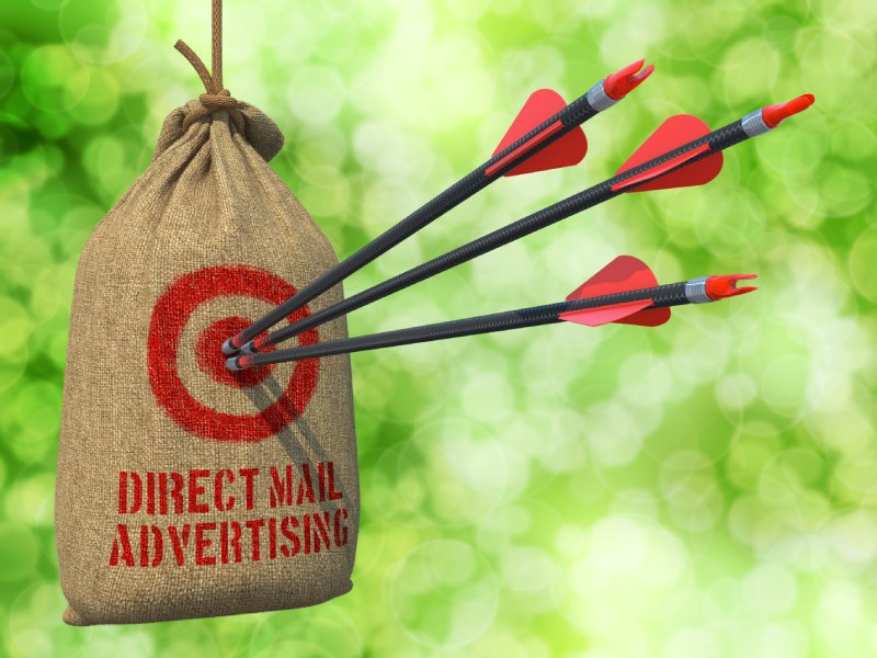 Arrows in a target in a conceptual image showing how effective postcard marketing can be