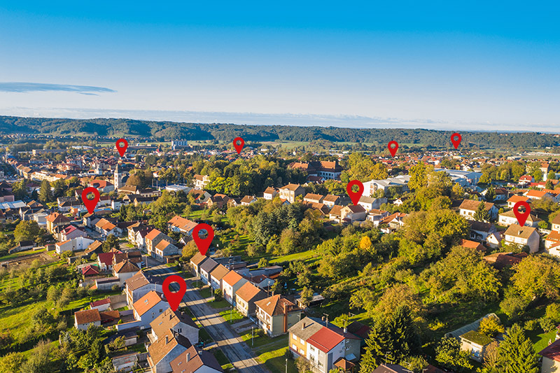 Direct Mail Dropping in a Neighborhood represented by GPS icons.