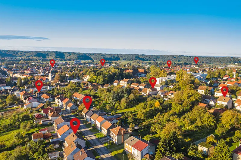 Direct Mail Dropping in a Neighborhood represented by GPS icons.